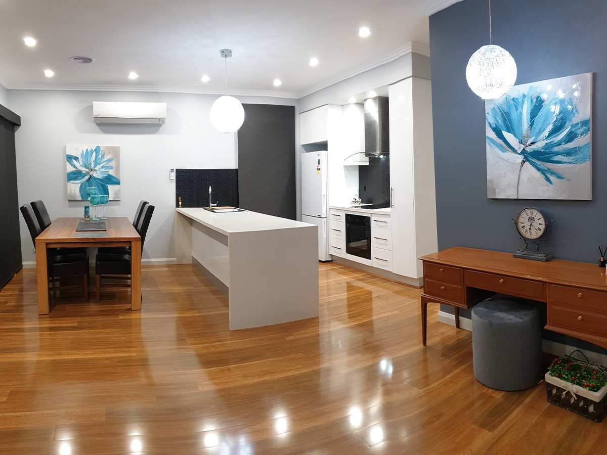 A wider view of the luxurious kitchen and dining space at Hunter House Moe Gippsland